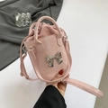 Pink glossy bucket bag with silver metal bow accent and matching detachable strap - Pink