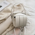 White woven bucket bag with structured leather texture and detachable silver chain strap - White