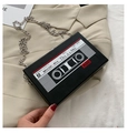 Close-up of retro cassette tape shaped black crossbody bag with silver chain strap - Black