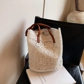 White floral lace tote bag with brown leather handles and magnetic snap closure - White