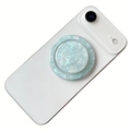 Close-up of a circular shell pattern phone socket with green pearlescent texture detail - Magnetic Stand / Transparent Green