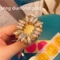 Detailed macro view of the sparkling rhinestone phone stand in flower shape gold finish - Expanding Stand / Long Diamond Gold
