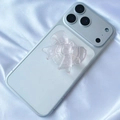 Close-up of a clear resin bow-shaped phone grip on a smartphone with white silk background - Light Pink