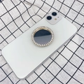 Supporto per telefono dorato con strass e specchio montato su uno smartphone bianco - Supporto Espandibile / Specchio Tondo con Strass