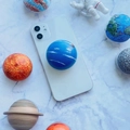 3D cartoon planet astronaut phone socket grip on white marble space background - Neptune