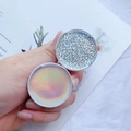 Detail view of round glitter and iridescent shell phone sockets with white base - Dotted Laser on White Base