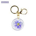 Golden keychain featuring a clear resin pendant with a real purple dried flower - Purple Dried Flower Style (B05)
