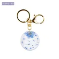 Golden resin keychain featuring real blue dried flowers in a circular crystal pendant - Deep Blue Dried Flower Style (B09)