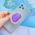 Purple gemstone phone socket with pearl border shown on a grey smartphone back - Purple with Pearl Border