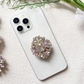 Macro detail of luxury flower phone grip with crystals and iridescent gemstones - Rainbow White Gem Flower (Rhombus Rainbow White - Airbag Stand)