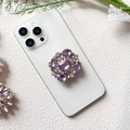 Macro detail of luxury purple crystal and diamond encrusted foldable phone socket grip - Rectangle Purple Gem (Amethyst - Airbag Stand)