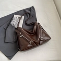 Deep brown oversized tote bag with silver hardware on a grey blazer outfit - Coffee