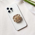 Detail of luxury champagne gold rhinestone phone grip with radiant crystal design - Champagne Gold Long Diamond 1 (Long Diamond Gold 1 - Airbag Stand)