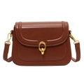 Brown leather crossbody bag with iconic gold buckle and adjustable straps on white background - Brown