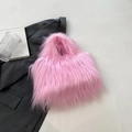 Bright pink faux fur handbag with a soft plush texture for stylish winter casual wear - Pink