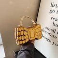Golden bow-shaped evening bag with quilted texture and metallic top handle - Gold