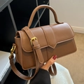 Dark brown leather crossbody bag with vertical stitching and gold hardware detail - Brown