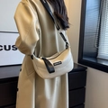Chic beige half-moon crossbody bag with wide logo strap and textured faux leather finish - Off White
