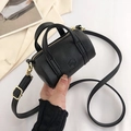 Minimalist black cylinder shoulder bag in lychee pattern leather with gold hardware - Black