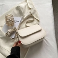 Minimalist cream white crossbody saddle bag with sleek leather finish for women - Off White
