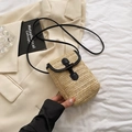Natural straw crossbody phone bag with black leather trim and horn-shaped button clasp - Black