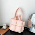 Pink quilted down tote bag with large square texture and dual handles in a soft setting - Pink