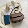 Chic brown retro crossbody bag in textured PU leather with adjustable strap and flap closure - Brown