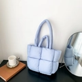 Light blue quilted down tote bag with padded grid pattern and dual-length handles - Blue