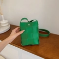Green woven leather mini crossbody phone bag with silver magnetic closure and long strap - Green