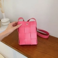 Pink woven crossbody bag in synthetic leather with silver snap and large grid texture - Pink