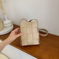 Minimalist beige woven leather crossbody bag with silver magnetic snap and long strap - Khaki