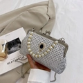 Sparkly white rhinestone clutch bag with pearl handle and navy blue gemstone detail - White