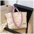 White quilted puffer tote bag with purple padded handles and fashion label detail - White and Purple