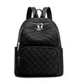 Modern black quilted nylon backpack featuring classic diamond stitching and silver zippers - Black