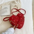 Red heart-shaped faux leather crossbody bag with iconic motorcycle jacket design and gold zips - Red