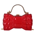 Red transparent bow-shaped clutch with gold handle and chain crossbody strap - Red