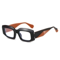 Retro Polygon-Sonnenbrille mit schwarz-orangefarbenem Rahmen im 45-Grad-Winkel präsentiert - Schwarz-Oranger Rahmen
