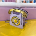 Retro telephone shaped crossbody bag in lilac purple with gold handset design - Purple