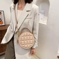 Beige quilted round crossbody bag with gold hardware and top handle for women - Milk Tea
