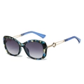 Lunettes de soleil papillon tendance avec motif écaille et verres dégradés - Monture Fleurs Bleues Verres Dégradés Gris