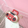 Retro radio-shaped crossbody bag with gold rivets and red accents in a pink cart - Gold