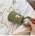 Detail of crocodile pattern leather bucket bag in Morandi green with gold chain strap - Green