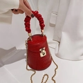 Red crocodile pattern bucket bag with gold chain strap and ruffled handle - Red