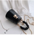 Black crocodile pattern cylindrical bucket bag with gold chain and pleated handle strap - Black