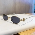 Occhiali da sole ovali dorati con lenti grigio scuro e fiori di strass luccicanti - Oro Lucido Grigio