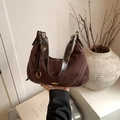 Vintage bruine suède hobo schoudertas met contrasterende stiksels en riem - Bruin