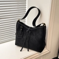 Minimalist black tote bag with white contrast stitching and tassel details - Black