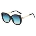 Modische Oversize-Sonnenbrille in Schwarz mit blauem Verlauf und perlenbesetzten Bügeln - Schwarzer Rahmen Grüne Gläser