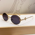 Retro round gold metal sunglasses featuring distinct 3D snake-shaped embossed temples - Solid Grey