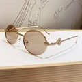 Golden round frame sunglasses featuring deep tea lenses and a detailed 3D snake design - Transparent Coffee (B626)